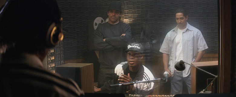 (L to R) Eazy-E (JASON MITCHELL) raps while Ice Cube (O’SHEA JACKSON, JR.), Dr. Dre (COREY HAWKINS) and DJ Yella (NEIL BROWN, JR.) listen in “Straight Outta Compton”. Taking us back to where it all began, the film tells the true story of how these cultura