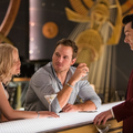 Aurora (JENNIFER LAWRENCE) and Jim (CHRIS PRATT) pay Arthur (MICHAEL SHEEN) a visit at the Grand Concourse Bar in Columbia Pictures’ PASSENGERS. PHOTO BY: Jaimie Trueblood ©2016 CTMG, Inc. All Right Reserved.