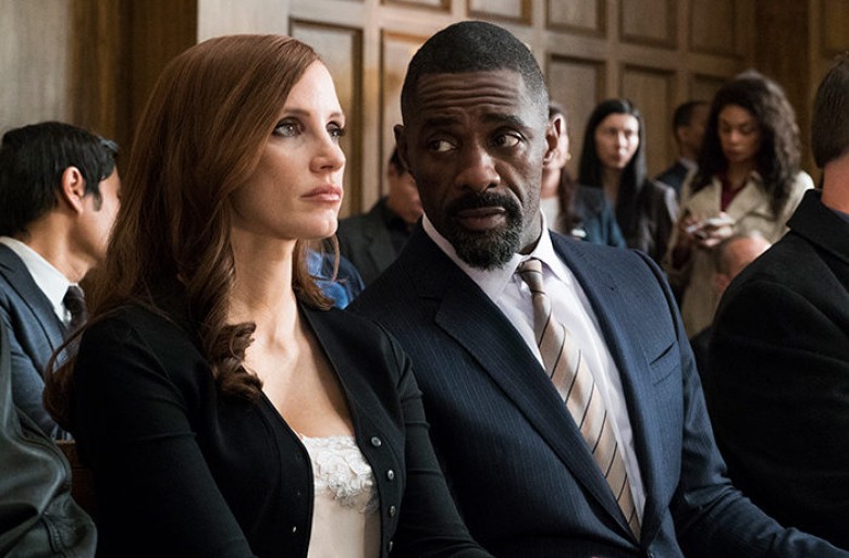Jessica Chastain and Idris Elba in MOLLY’S GAME. Photo Credit: Michael Gibson- Motion Picture Artwork © 2017 STX Financing, LLC. All Rights Reserved.