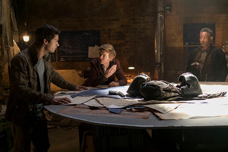 Thomas (Dylan O’Brien) and Newt (Thomas Brodie-Sangster) debate what to do, while Jorge (Giancarlo Esposito) watches. Photo credit: Joe Alblas – TM & © 2017 Twentieth Century Fox Film Corporation. All Rights Reserved. Not for sale or duplication.