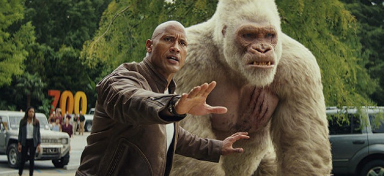 © 2018 WARNER BROS. ENTERTAINMENT INC. Photo Credit: Courtesy of Warner Bros. Pictures Caption: (L-R) DWAYNE JOHNSON as Davis Okoye and JASON LILES as George in New Line Cinema’s and ASAP Entertainment’s action adventure “RAMPAGE,” a Warner Bros. Pictures