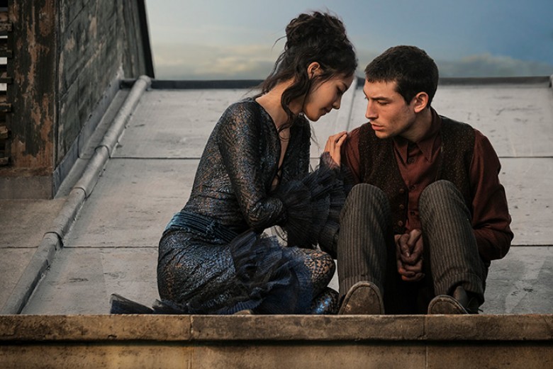 © 2018 WARNER BROS. ENTERTAINMENT INC. Photo Credit: Jaap Buitendijk Caption: (L-r) CLAUDIA KIM as Nagini and EZRA MILLER as Credence in Warner Bros. Pictures’ fantasy adventure “FANTASTIC BEASTS: THE CRIMES OF GRINDELWALD,” a Warner Bros. Pictures releas
