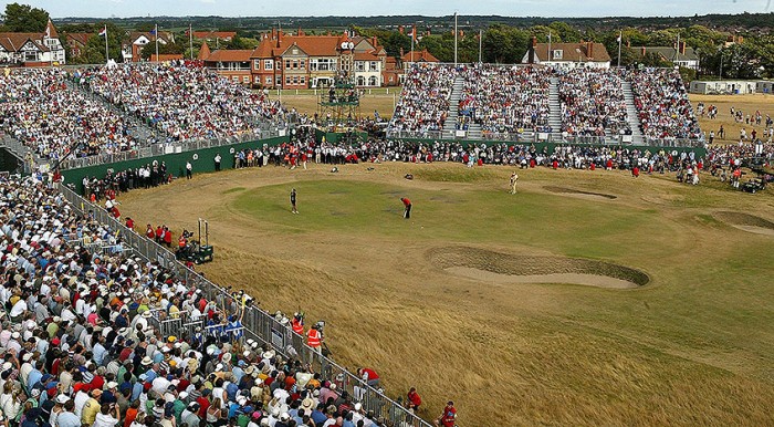 Tiger Woods putts on the weather torn 18th green during his victory at the 2006 Open Championship at Royal Liverpool
