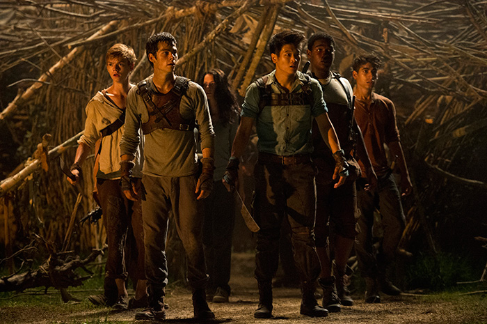 (From left) Newt (Thomas Brodie-Sangster), Thomas (Dylan O’Brien), Teresa (Kaya Scoderlario), Minho (Ki Hong Lee), Frypan (Dexter Darden), and Winston (Alex Flores) react to a shocking development in the Glade. Photo Credit: Ben Rothstein TM and © 2014 Tw