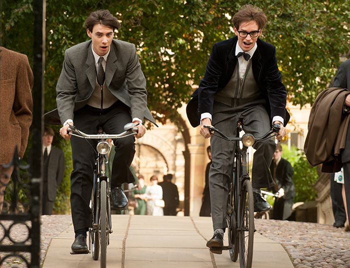 (l-r.) Cambridge students Brian (Harry Lloyd) and Stephen (Eddie Redmayne) go for a spin in Academy Award-winning director James Marsh’s drama THE THEORY OF EVERYTHING