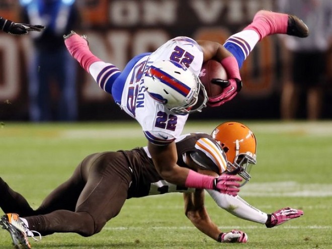 Bills' RB Fred Jackson dives over a Cleveland defender